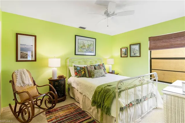 a bedroom with a bed and chair