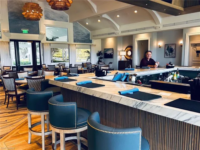 a kitchen with a dining table and chairs
