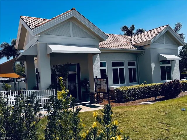 a view of a house with a flower garden