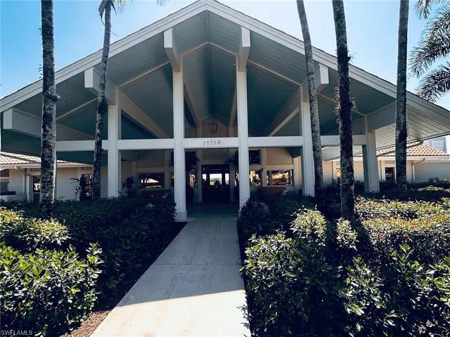 a living room with furniture and flat screen tv