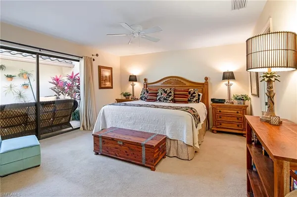 a bedroom with a bed and a walk in closet