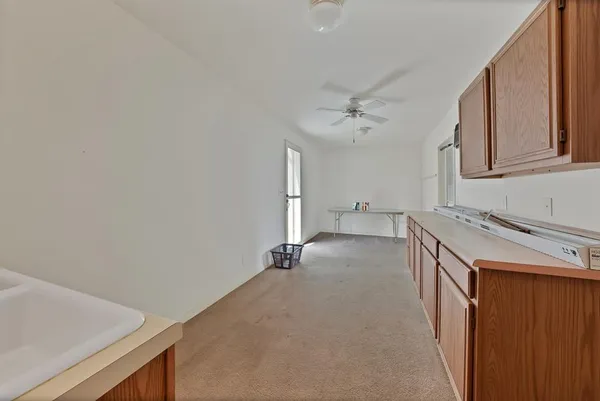 a view of a kitchen with a sink and dishwasher
