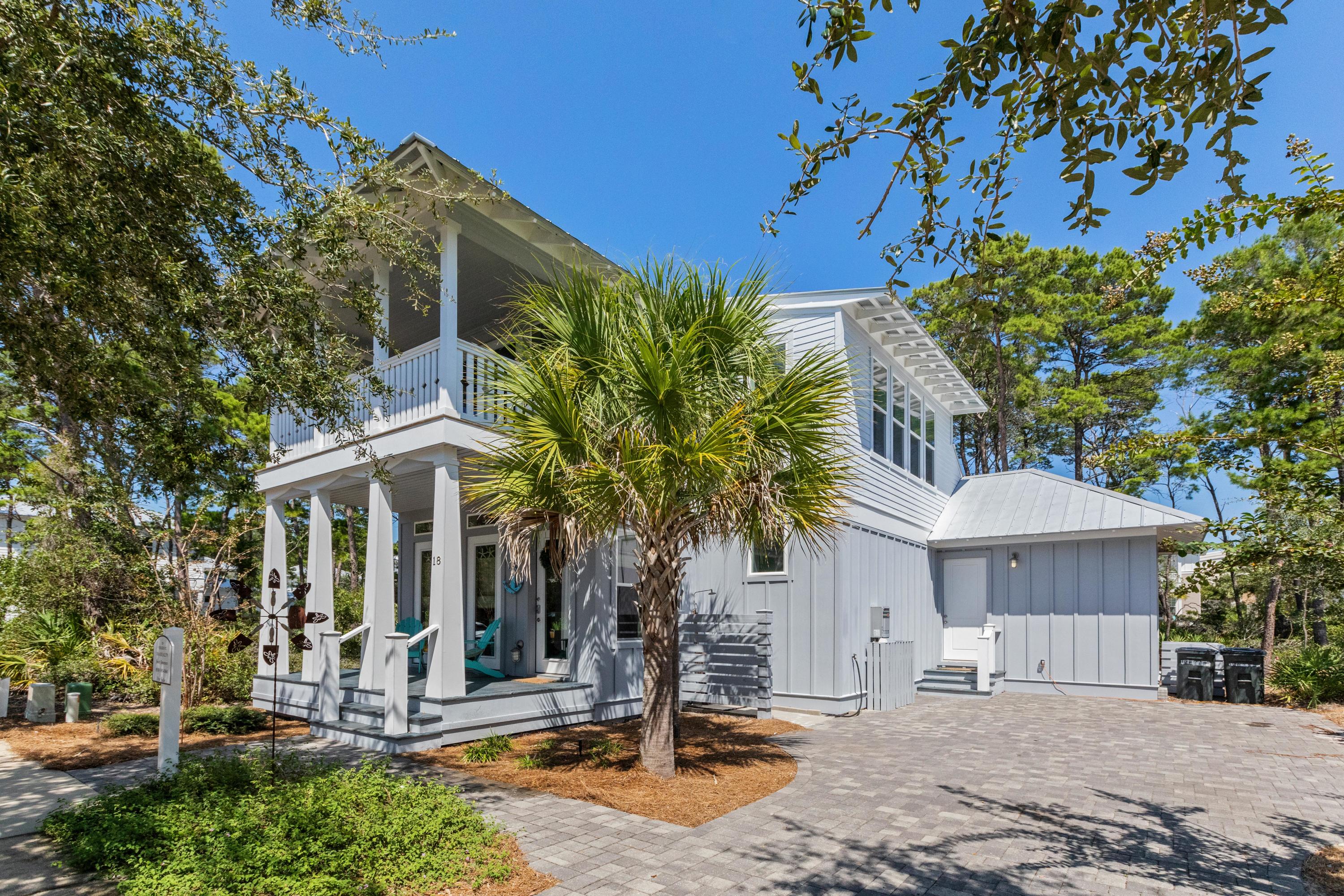 18 Hiker Street Santa Rosa Beach, FL 32459 - Photo 1 of 39 a front view of a house with garden