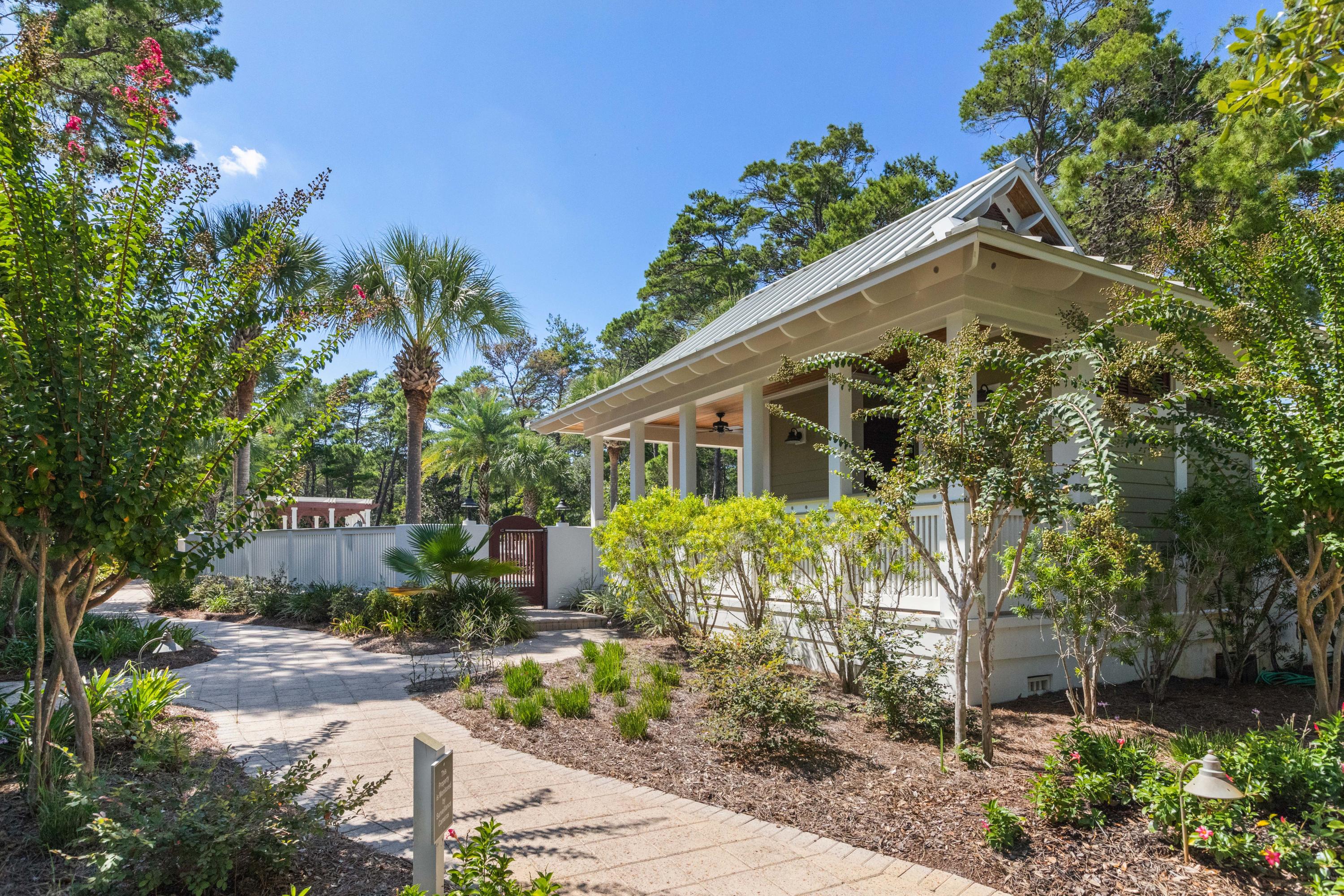 18 Hiker Street Santa Rosa Beach, FL 32459 - Photo 33 of 39 a front view of a house with garden