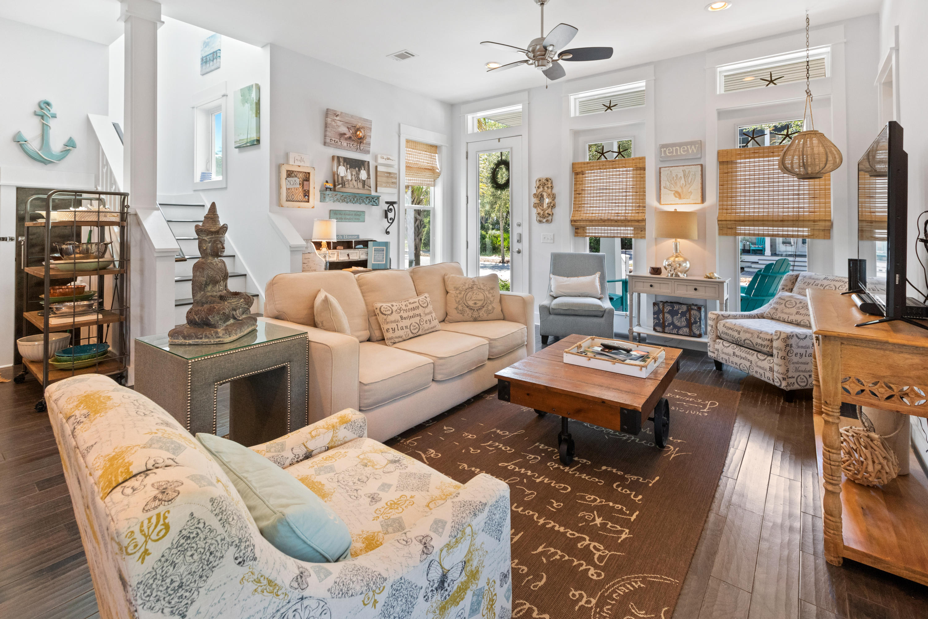 18 Hiker Street Santa Rosa Beach, FL 32459 - Photo 5 of 39 a living room with furniture a rug and a chandelier