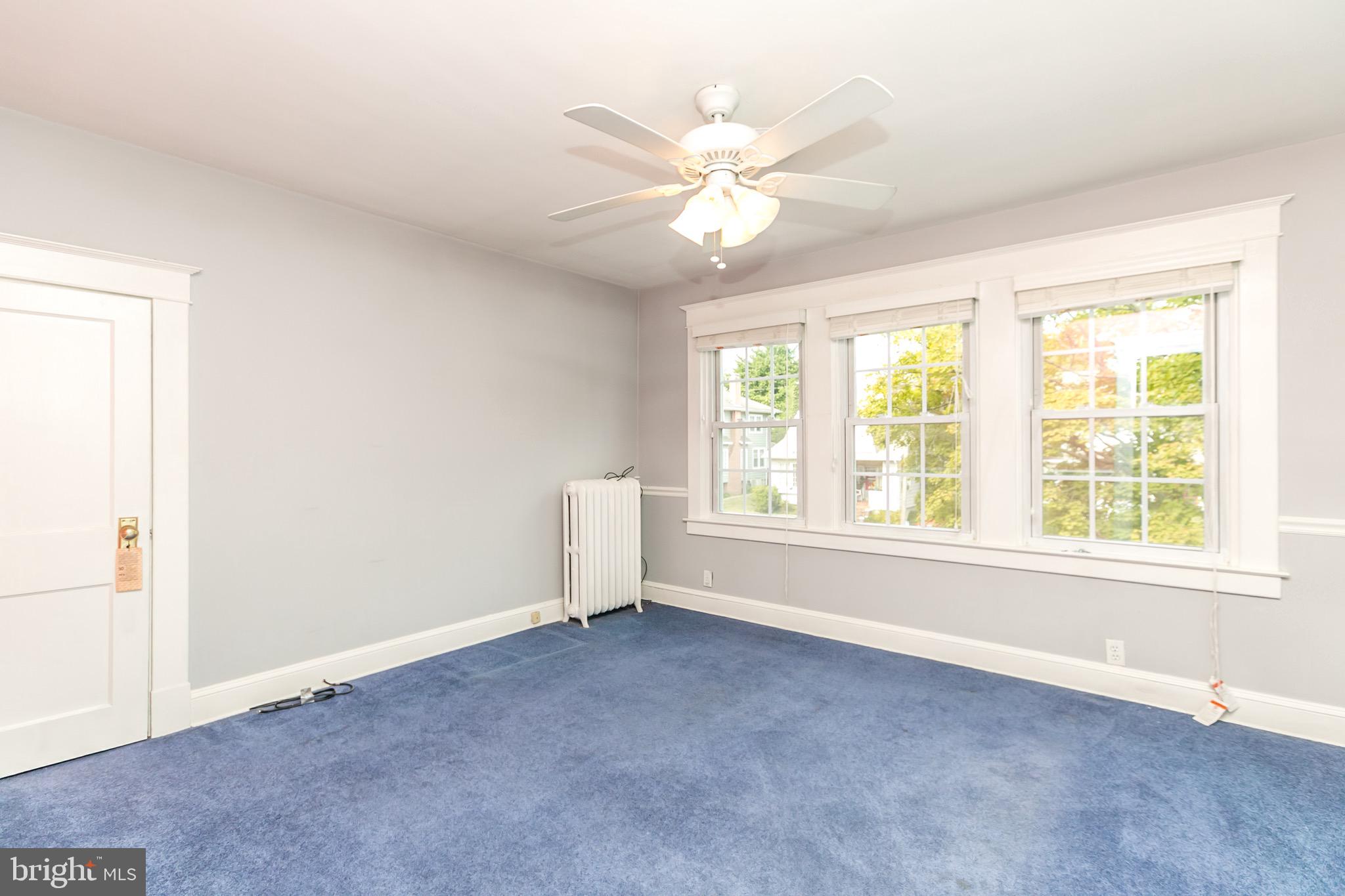 513 Anneslie Road Baltimore, MD 21212 - Photo 19 of 29 Main bedroom with ceiling fan and large windows