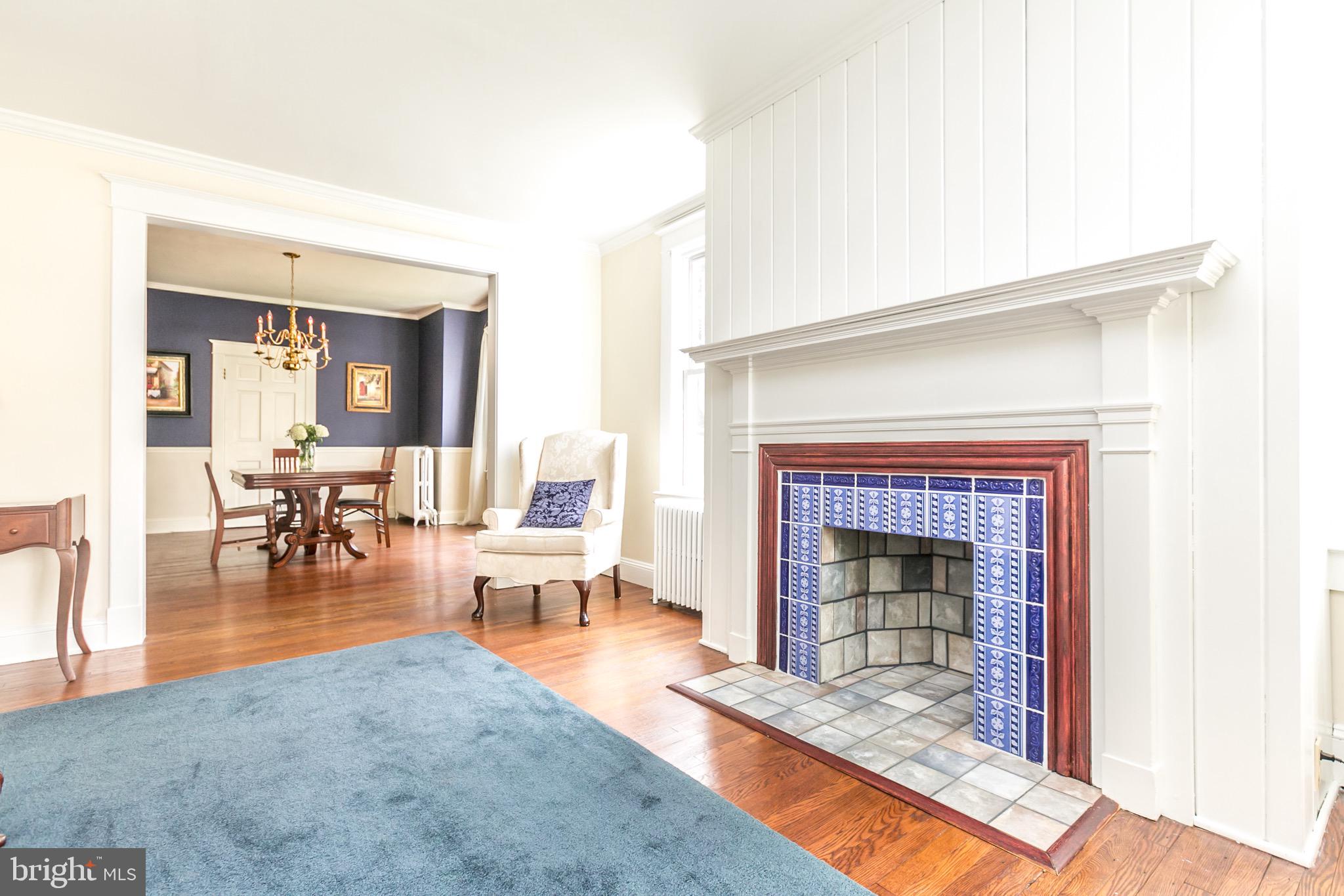 513 Anneslie Road Baltimore, MD 21212 - Photo 5 of 29 Living room with decorative faux fireplace.