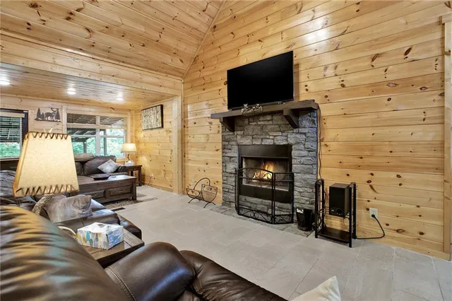 a living room with furniture and a dining table