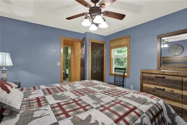 a bedroom with a bed and window