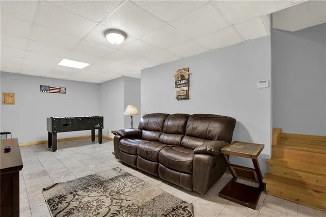 a bathroom with a toilet sink vanity and mirror