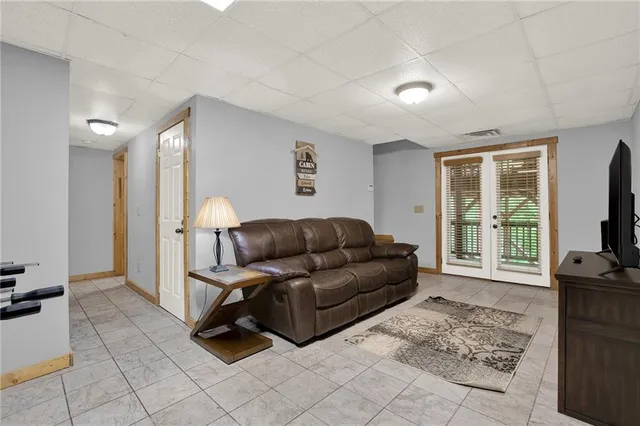 a view of porch with a table and chairs
