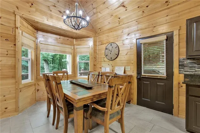a kitchen with granite countertop stainless steel appliances and refrigerator