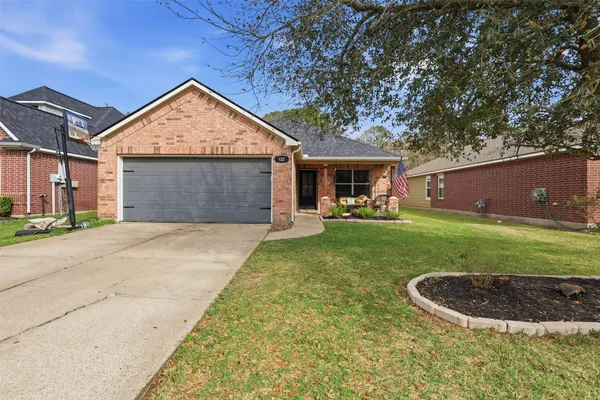front view of a house with a yard