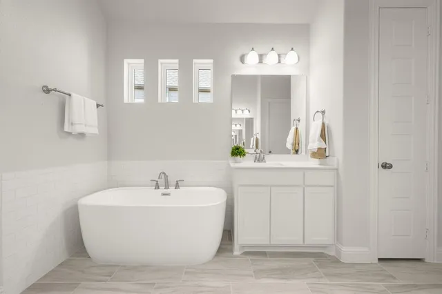 a bathroom with a sink a mirror and a shower