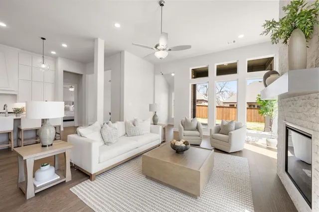 a large kitchen with dining table and chairs