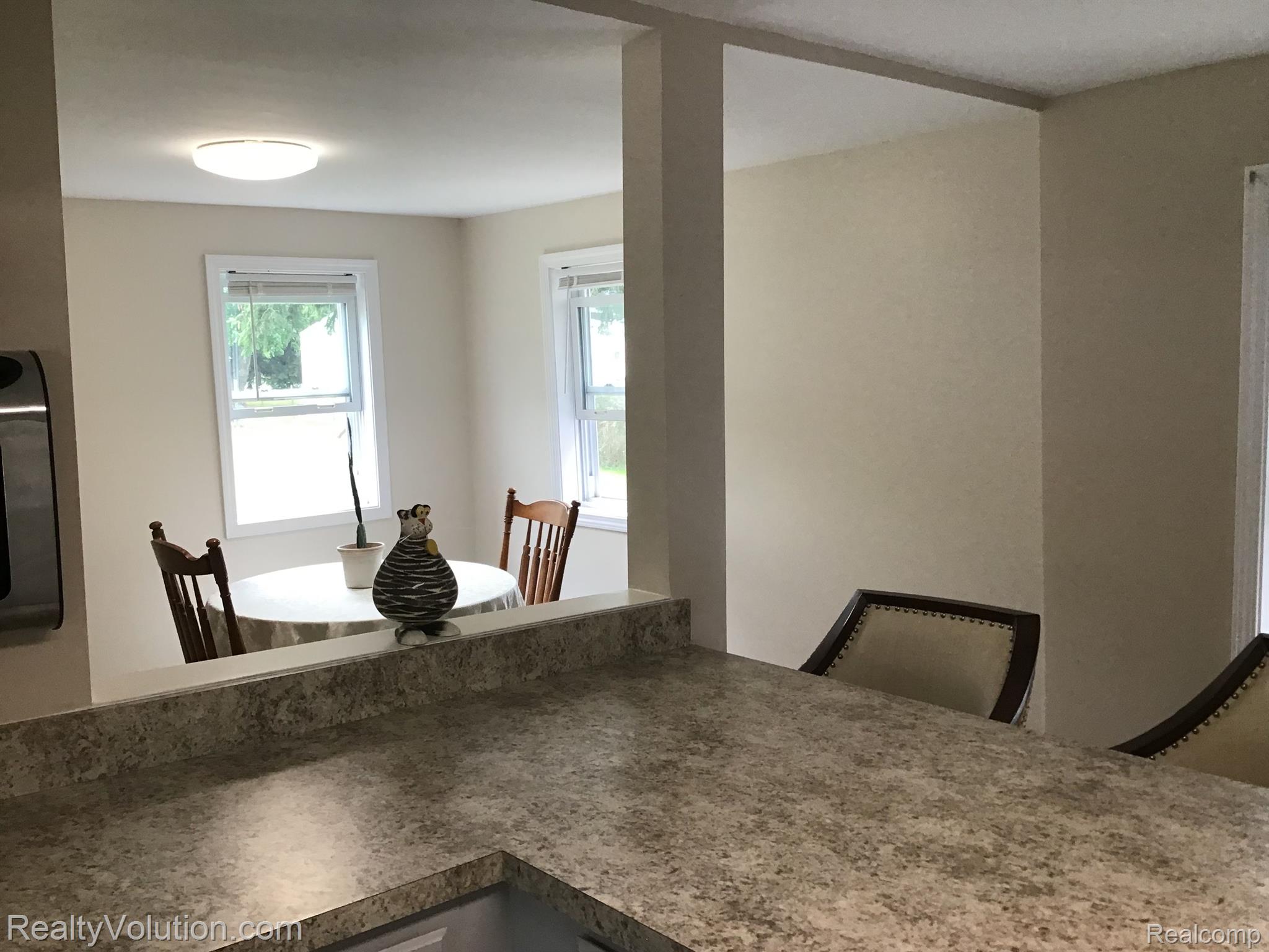 4069 South Mill Road Dryden, MI 48428 - Photo 8 of 25 opening from first floor kitchen to living room