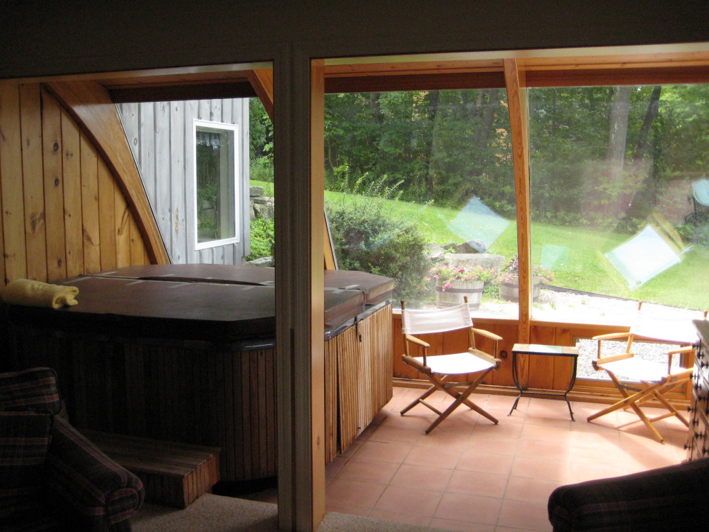 21 Cooper Creek Road Tyringham, MA 01238 - Photo 14 of 16 a living room with a large window and a table