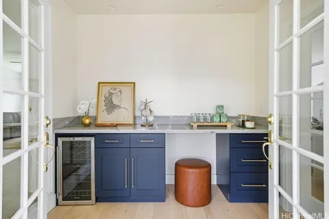 a view of a kitchen with a sink and cabinet