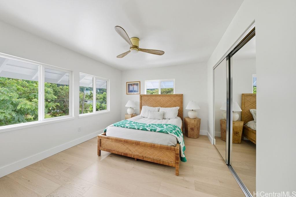 3198 Alika Avenue Honolulu, HI 96817 - Photo 18 of 25 a bedroom with a bed and large window