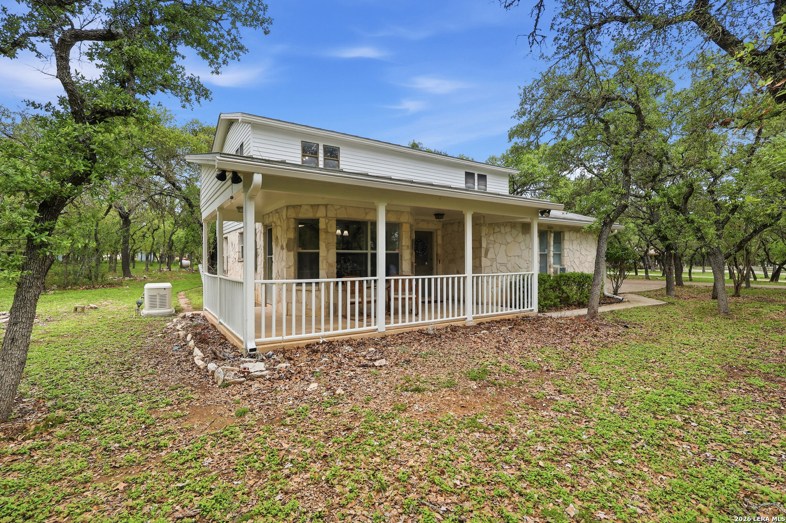 261 Fawn Lane Spring Branch, TX 78070 - Photo 41 of 44 a view of a house with a small yard and wooden fence
