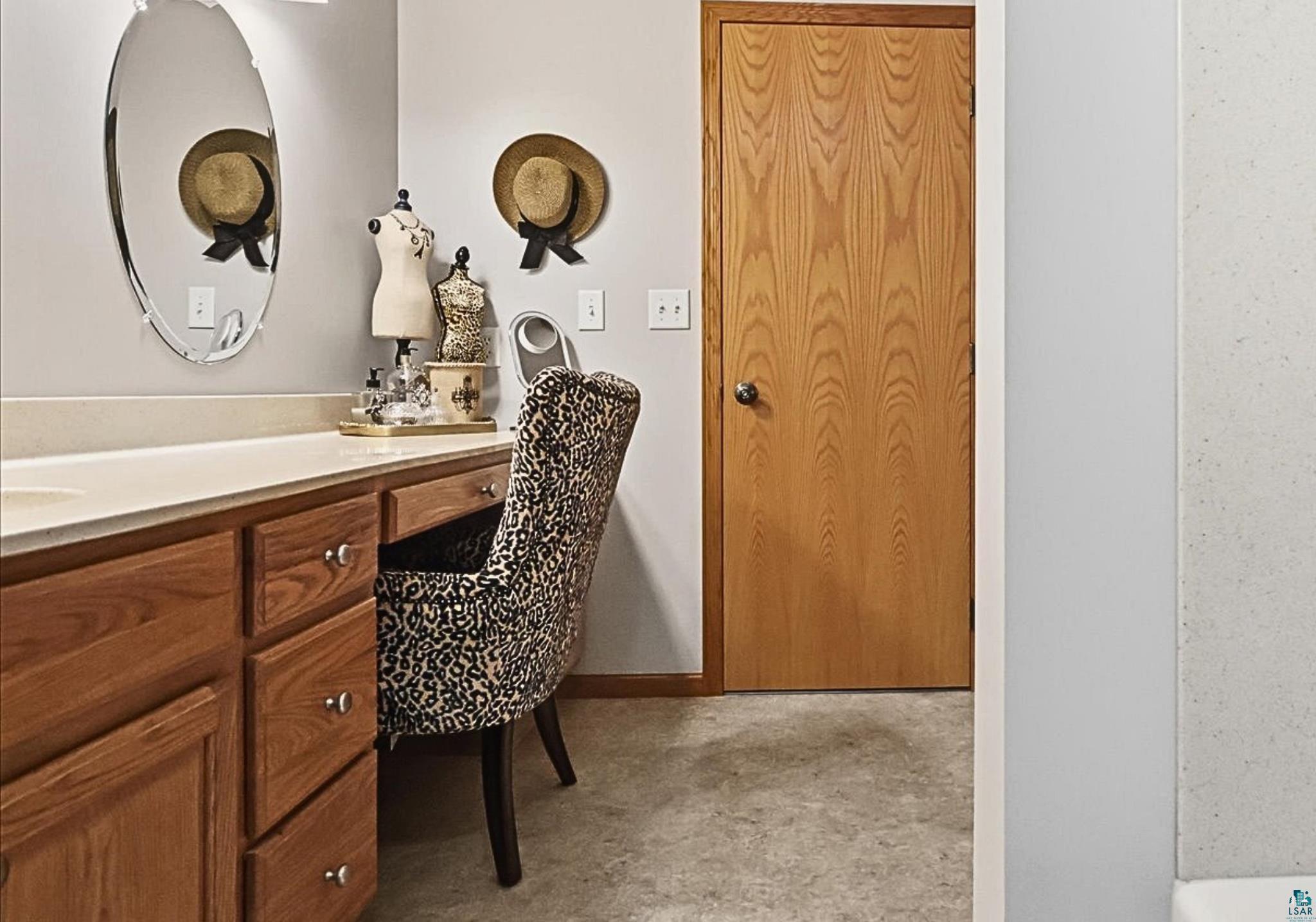 41 East Stark Road Esko, MN 55733 - Photo 12 of 19 Light-toned wood vanity with multiple storage drawers and a built-in makeup area