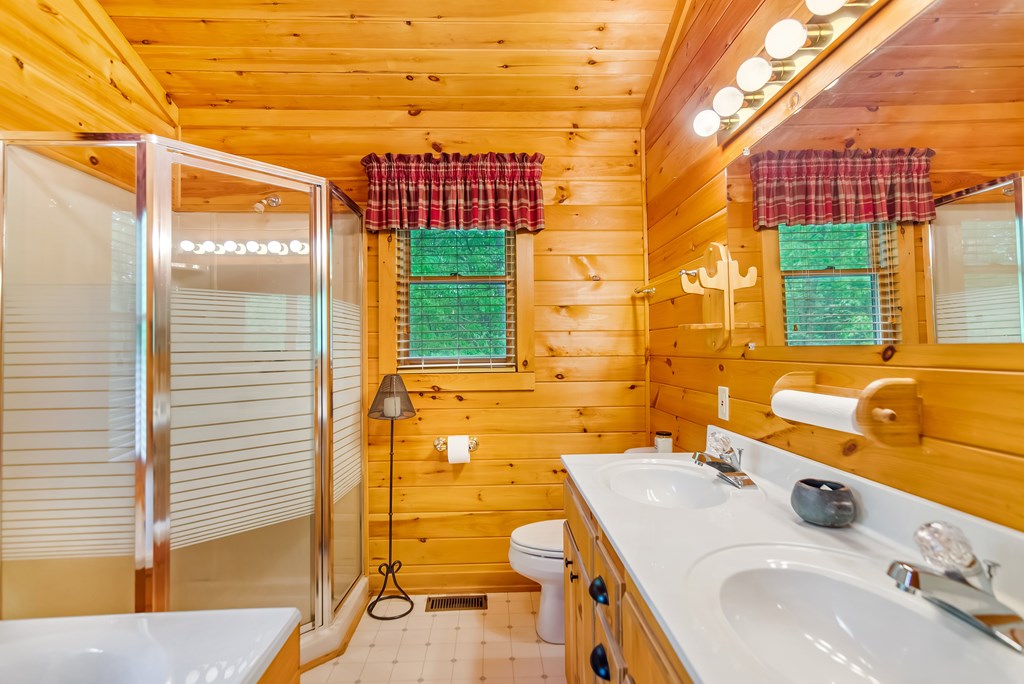 4834 Squirrel Hunting Road Morganton, GA 30560 - Photo 42 of 48 a bathroom with a sink and a mirror
