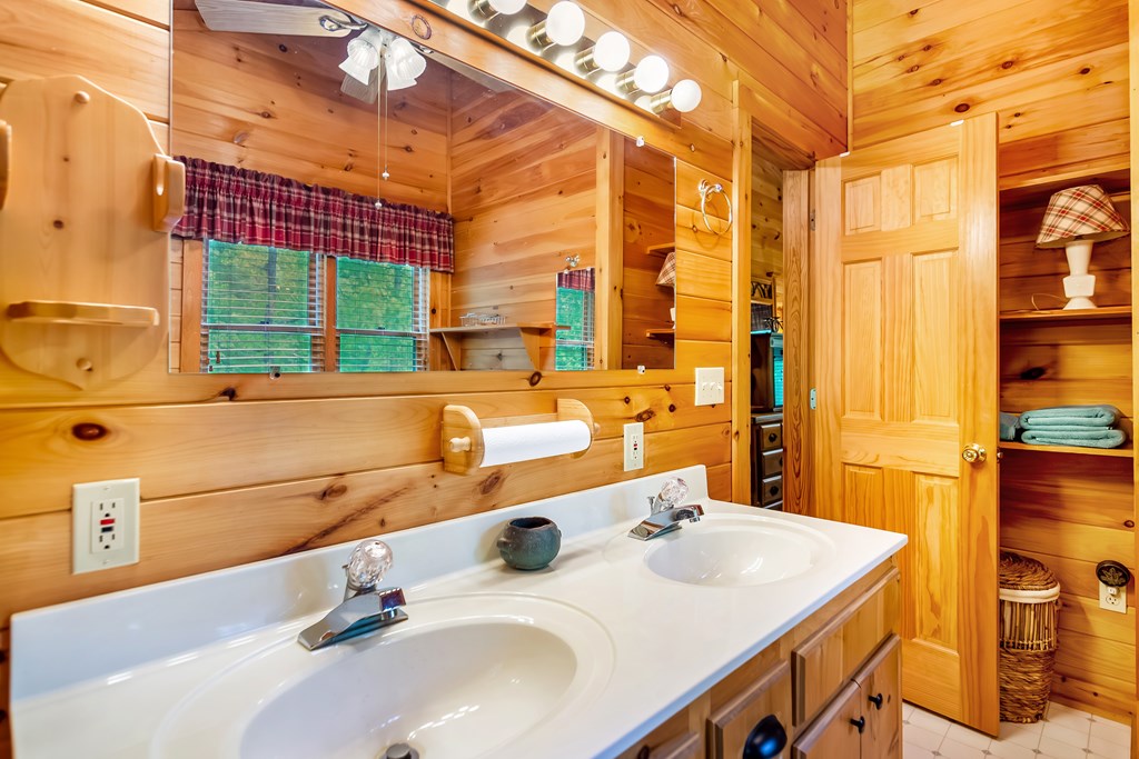 4834 Squirrel Hunting Road Morganton, GA 30560 - Photo 44 of 48 a bathroom with a sink and a large mirror