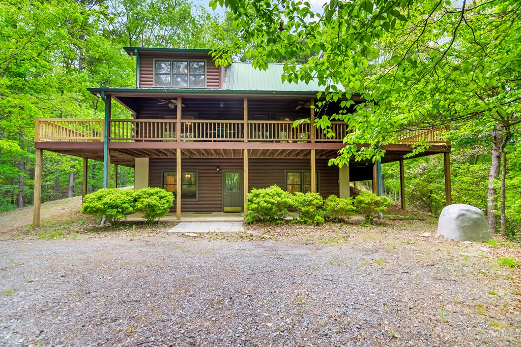 4834 Squirrel Hunting Road Morganton, GA 30560 - Photo 5 of 48 a front view of a house with garden