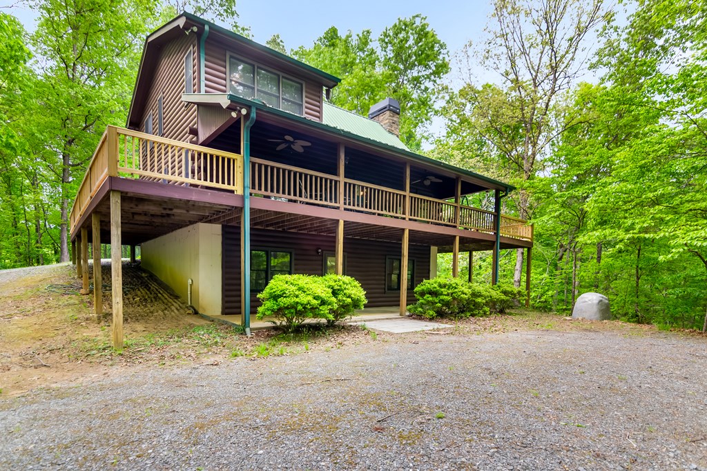 4834 Squirrel Hunting Road Morganton, GA 30560 - Photo 6 of 48 a front view of a house with garden