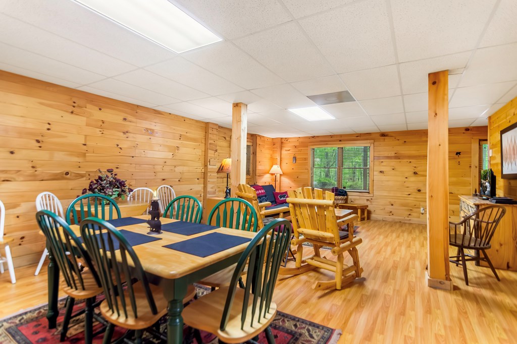 4834 Squirrel Hunting Road Morganton, GA 30560 - Photo 10 of 48 a view of a dining room with furniture one side kitchen view and wooden floor