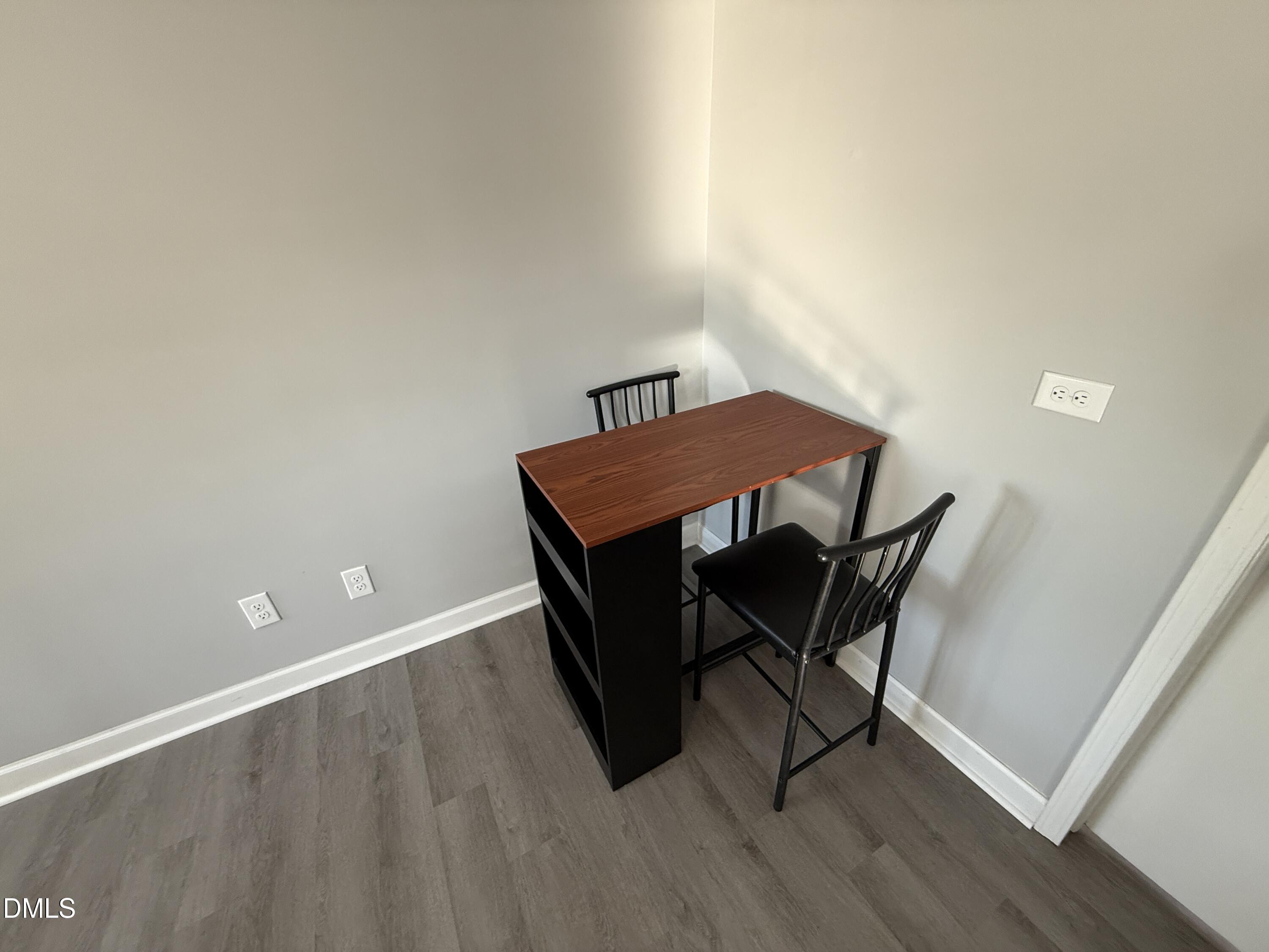 895 Stewart Road Four Oaks, NC 27524 - Photo 11 of 38 a view of a workspace with furniture and wooden floor