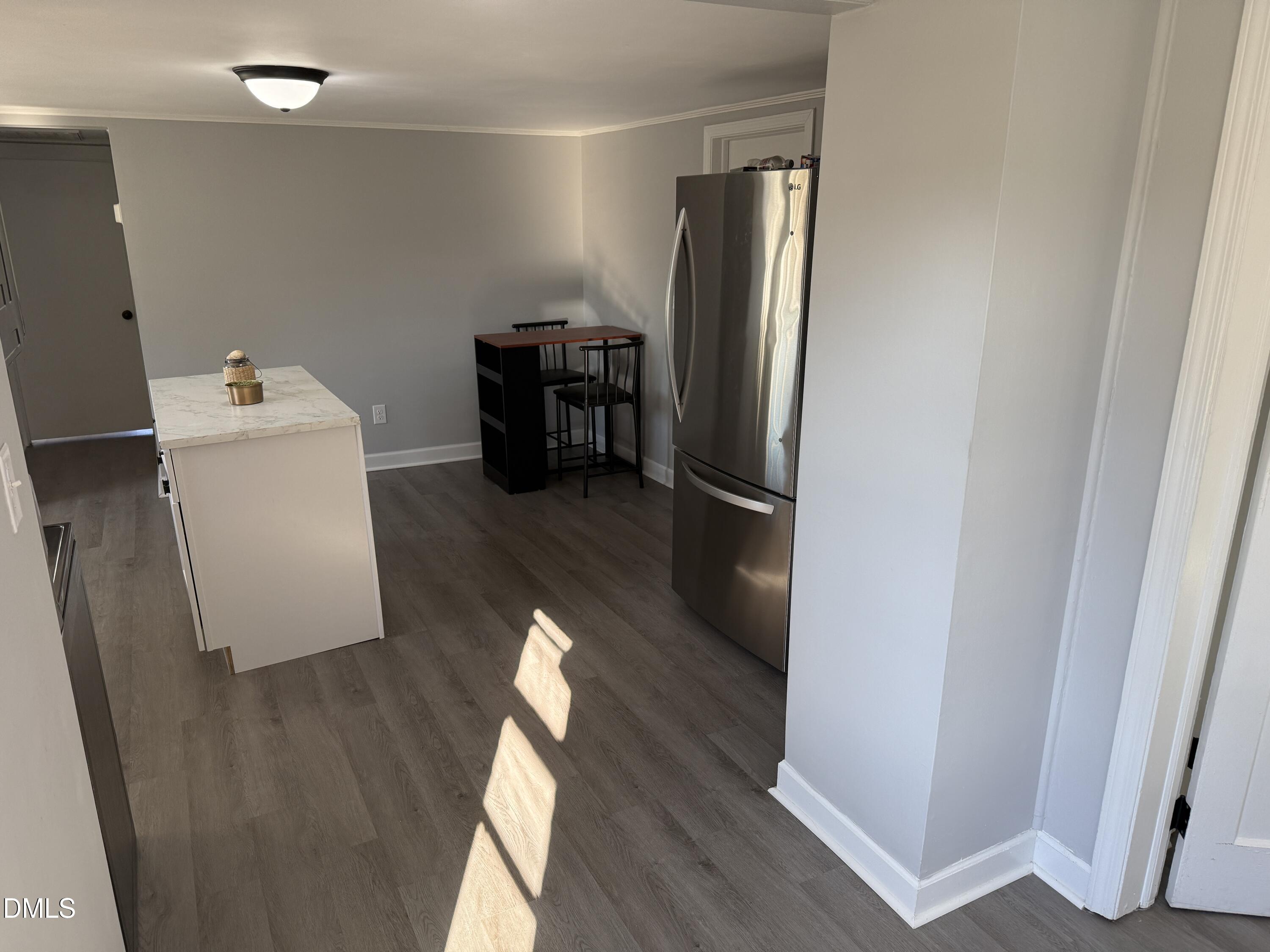 895 Stewart Road Four Oaks, NC 27524 - Photo 12 of 38 a room with wooden floor and furniture