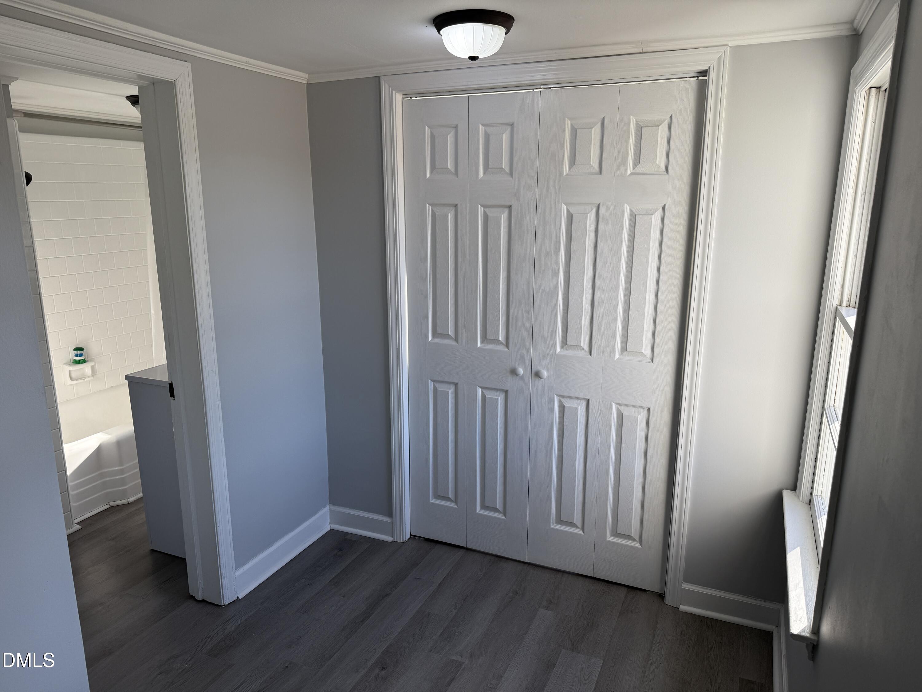 895 Stewart Road Four Oaks, NC 27524 - Photo 13 of 38 an empty room with wooden floor