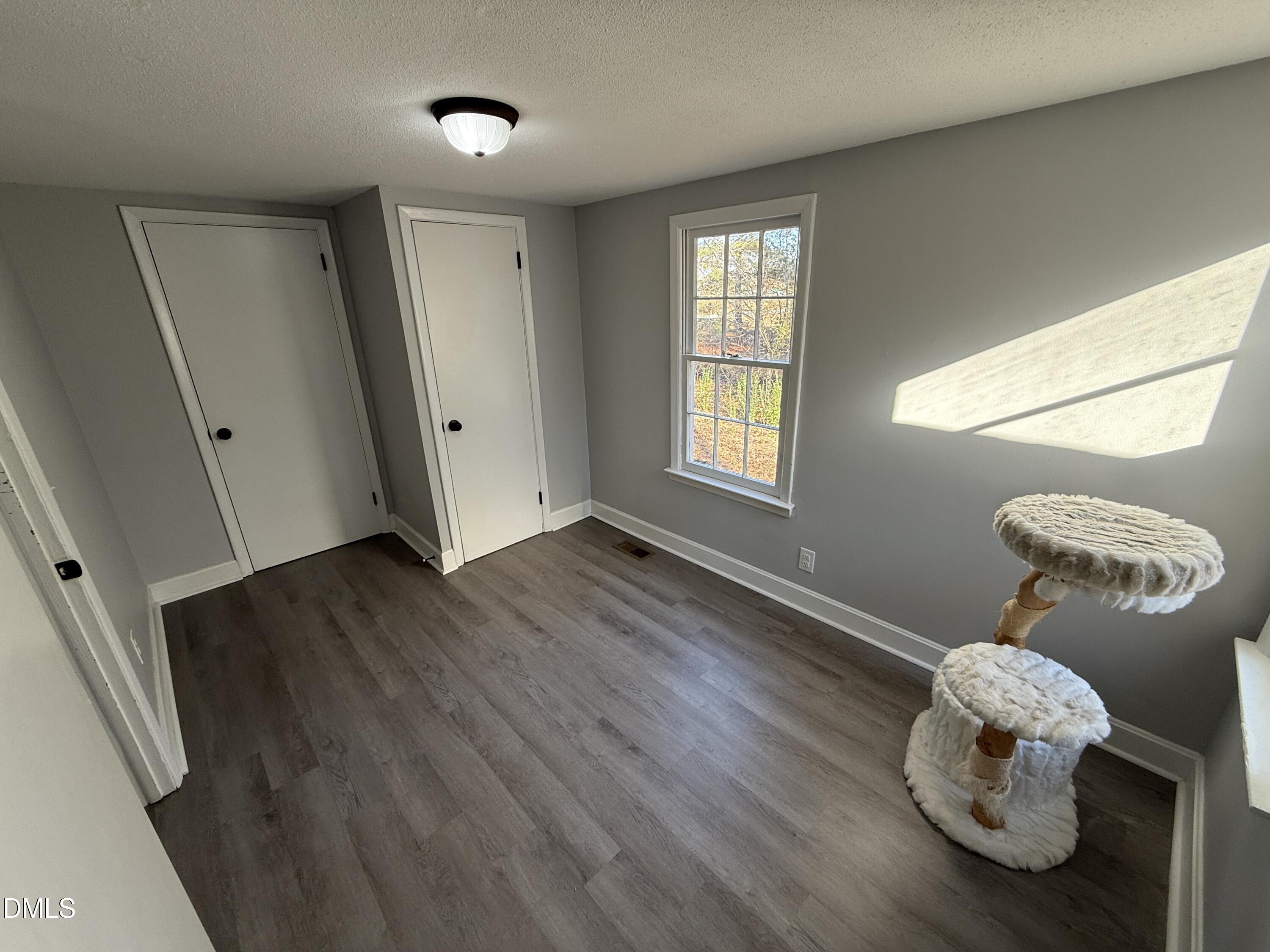 895 Stewart Road Four Oaks, NC 27524 - Photo 21 of 38 a view of a livingroom with wooden floor