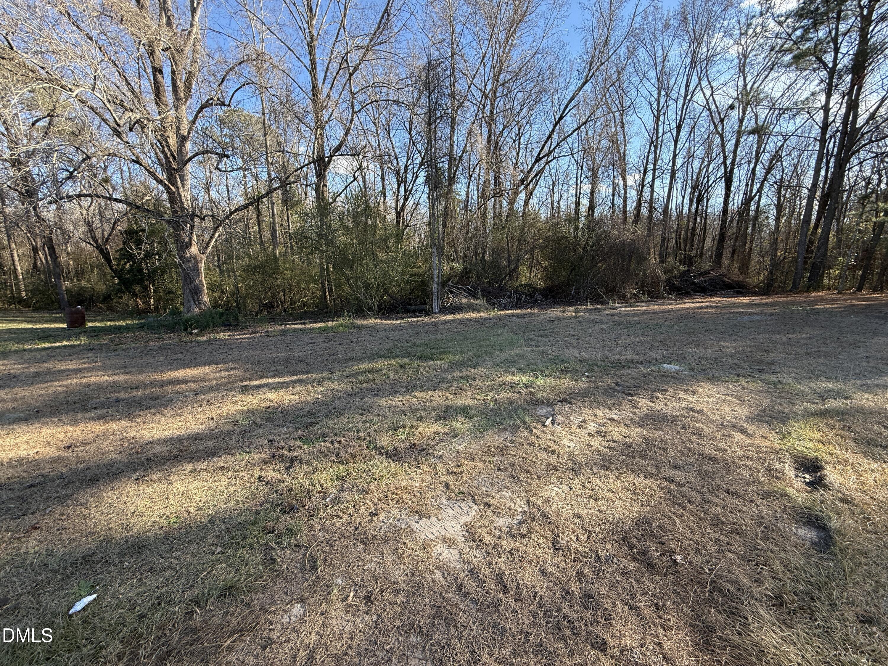 895 Stewart Road Four Oaks, NC 27524 - Photo 24 of 38 a view of a yard with large trees