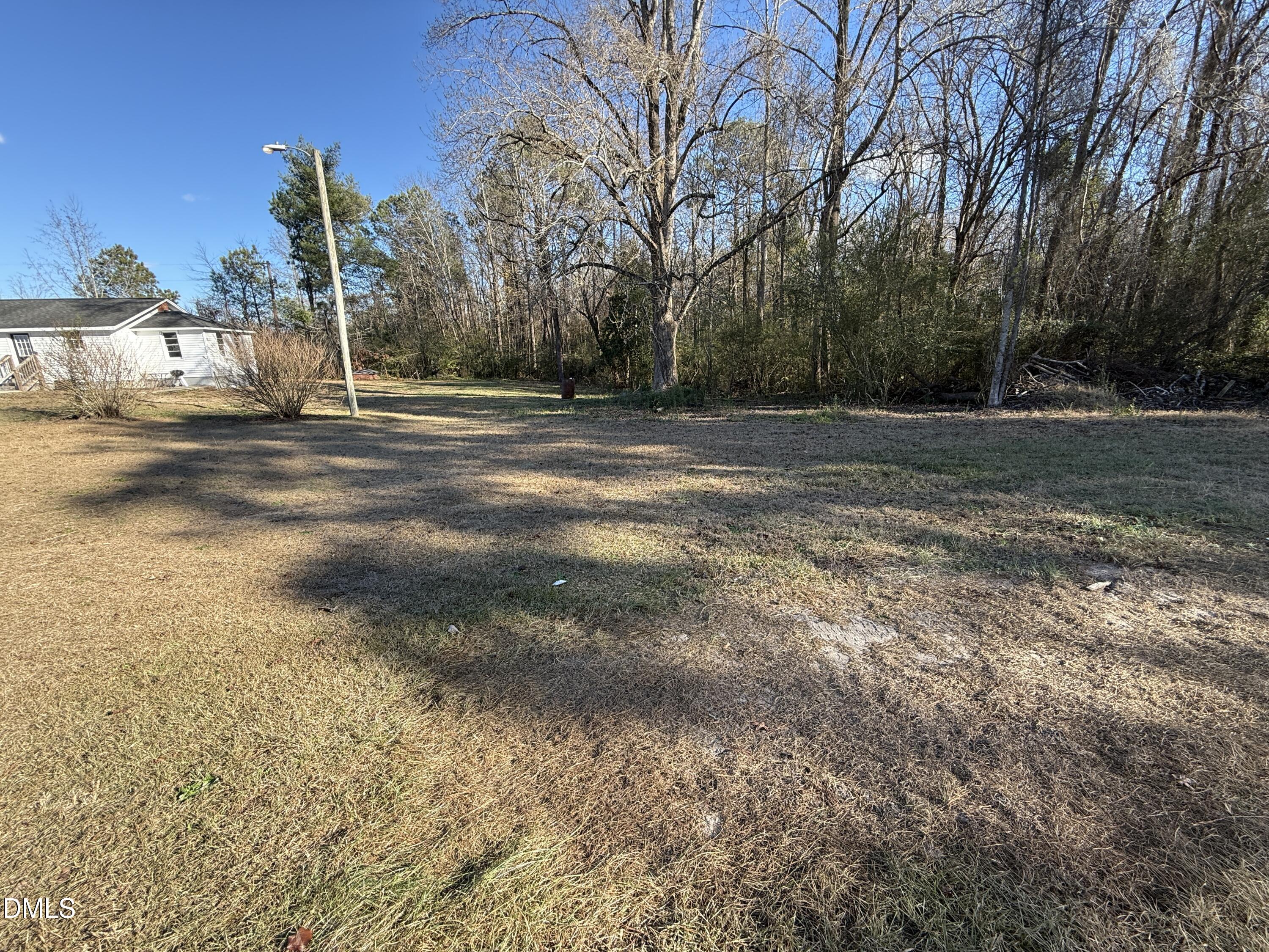 895 Stewart Road Four Oaks, NC 27524 - Photo 25 of 38 a view of a house with a yard
