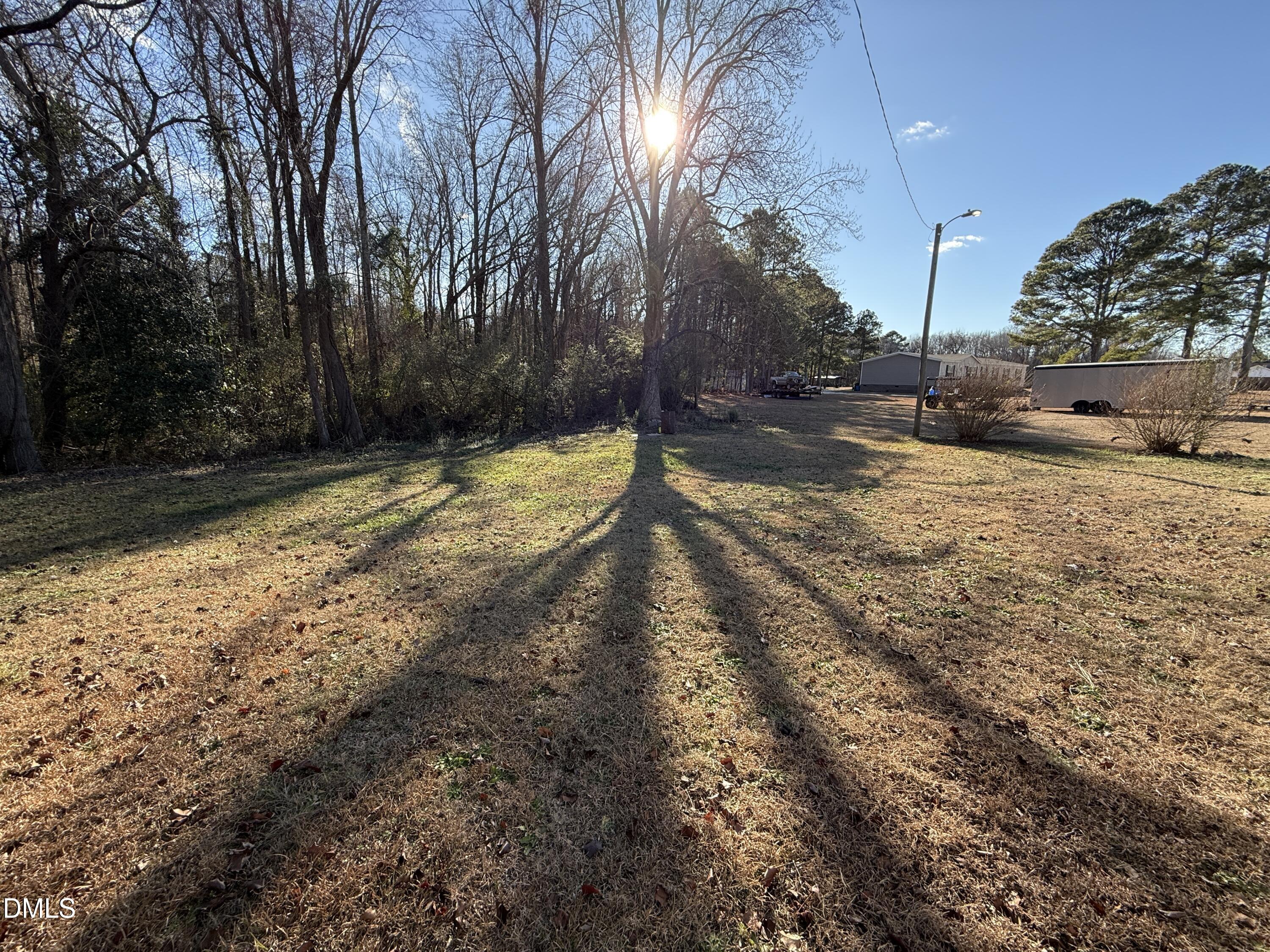 895 Stewart Road Four Oaks, NC 27524 - Photo 34 of 38 a view of a yard with trees