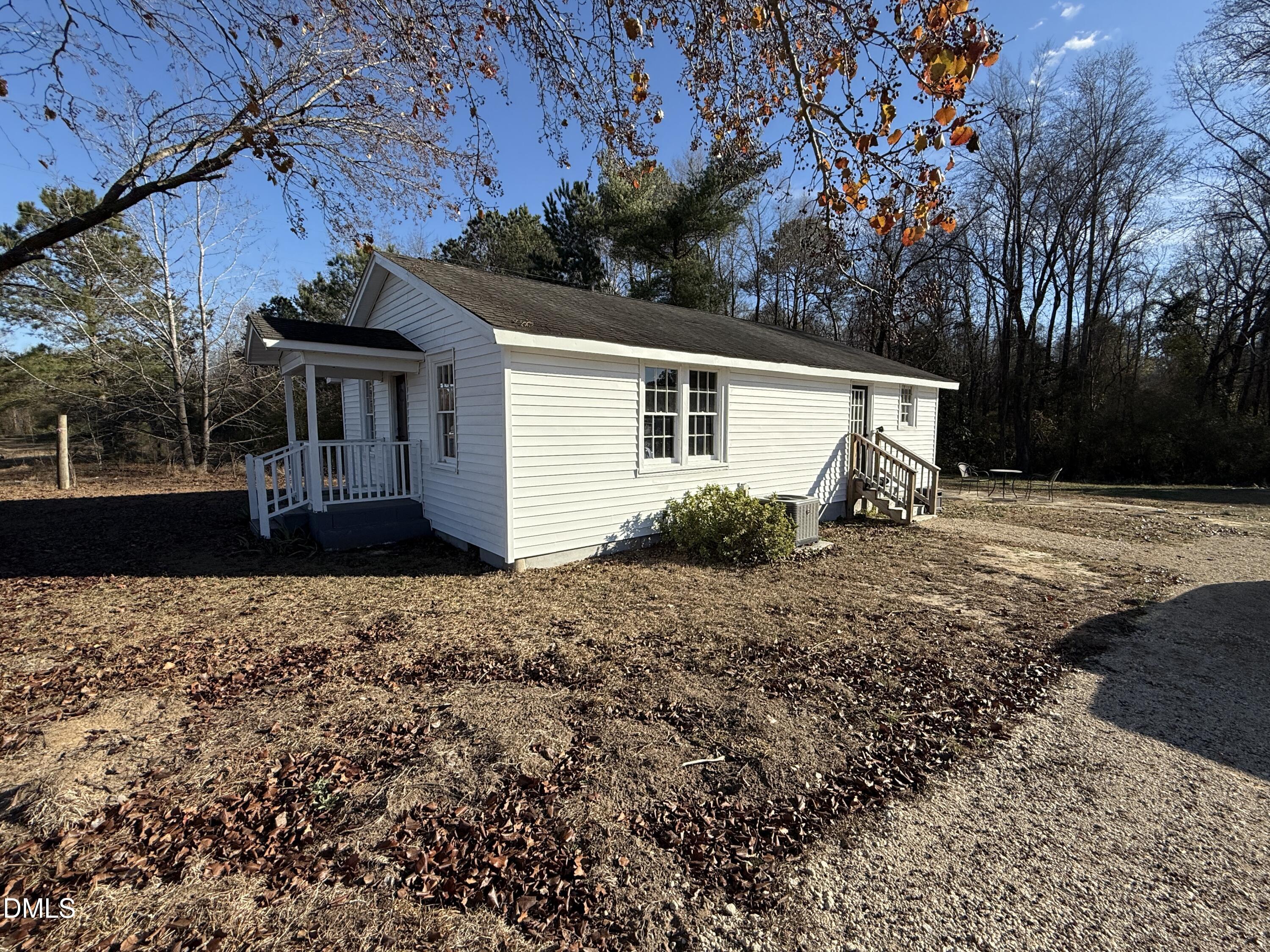 895 Stewart Road Four Oaks, NC 27524 - Photo 36 of 38 a view of a house with a yard