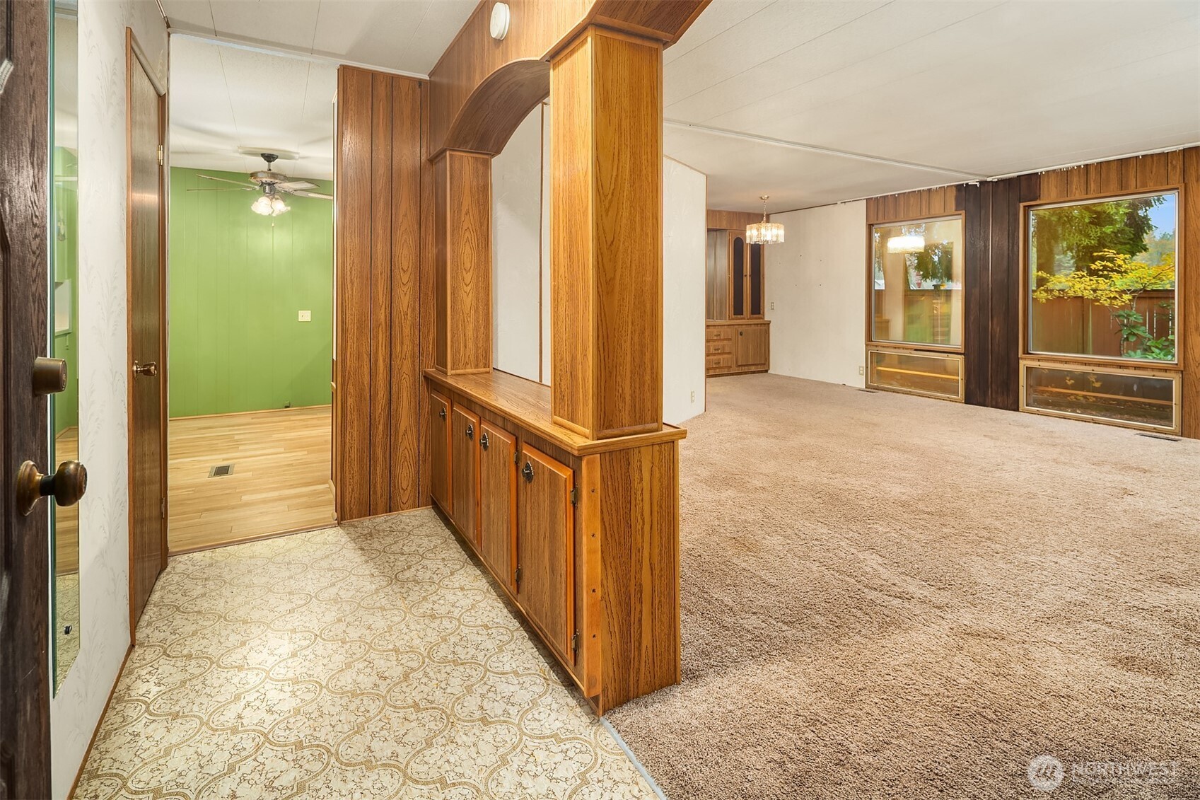 12800 Northeast 190th Place Bothell, WA 98011 - Photo 13 of 22 a view of a hallway with wooden shelves and door