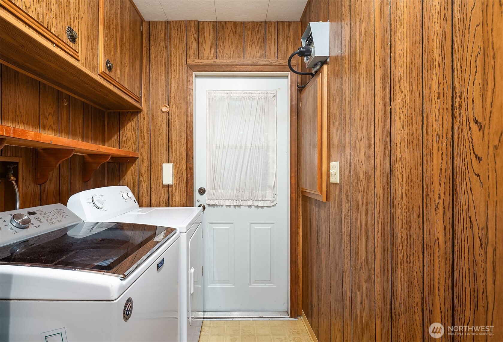 12800 Northeast 190th Place Bothell, WA 98011 - Photo 16 of 22 a kitchen with a stove and a refrigerator