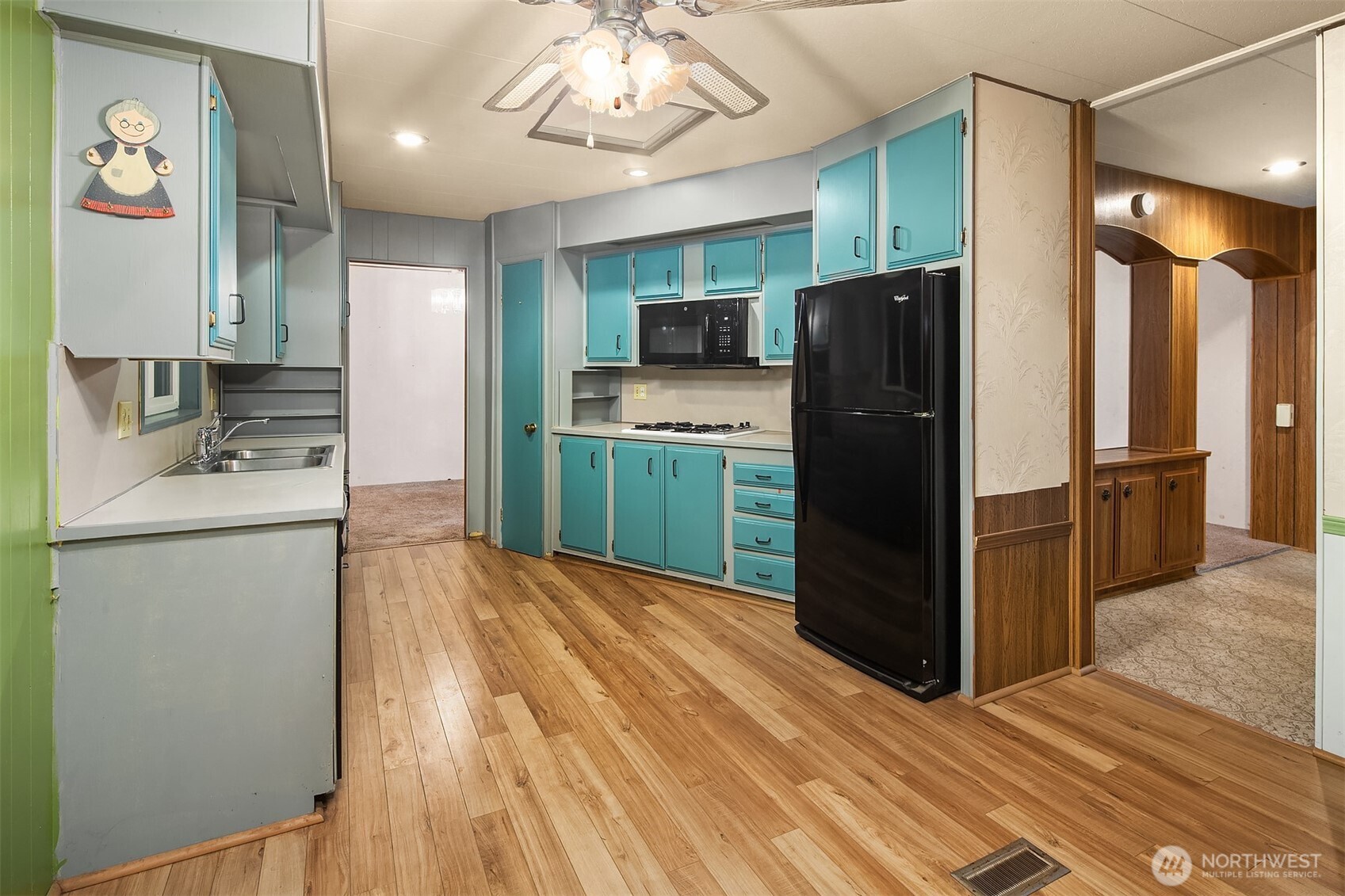 12800 Northeast 190th Place Bothell, WA 98011 - Photo 4 of 22 a kitchen with a refrigerator a stove top oven a sink and dishwasher