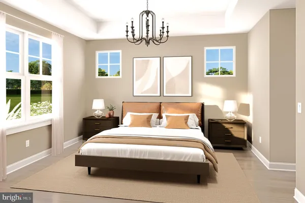 a bedroom with a bed chandelier and a window
