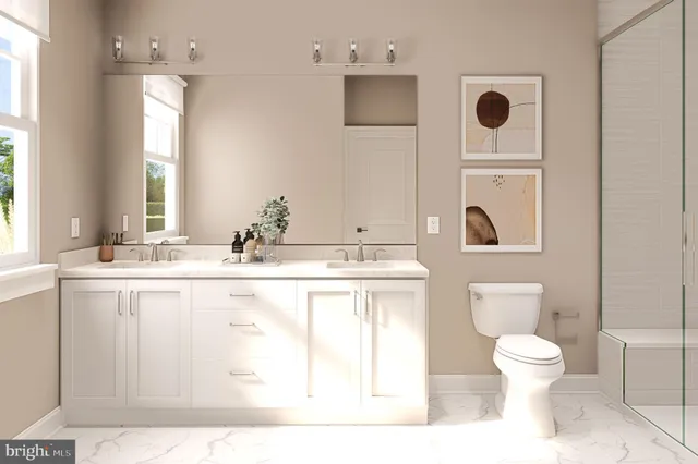 a bathroom with a toilet sink a mirror and a shower