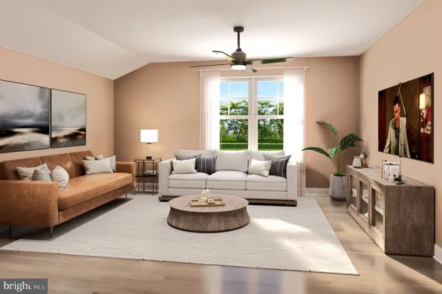 a living room with furniture fireplace and flat screen tv