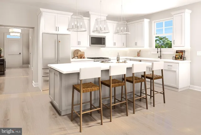 a dining hall with stainless steel appliances kitchen island granite countertop a dining table chairs and granite counter tops