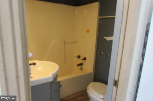 a bathroom with a sink and toilet