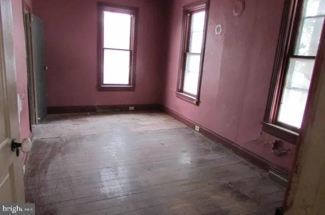 an empty room with windows