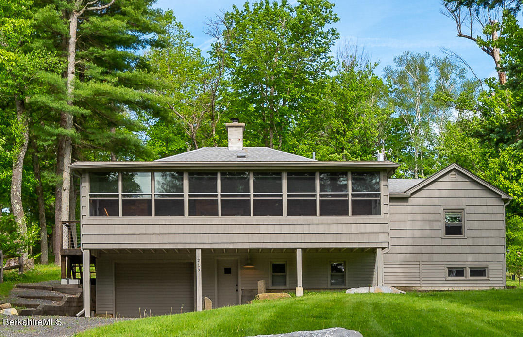 219 Shore Road Richmond, MA 01201 - Photo 1 of 28 a front view of a house with a garden