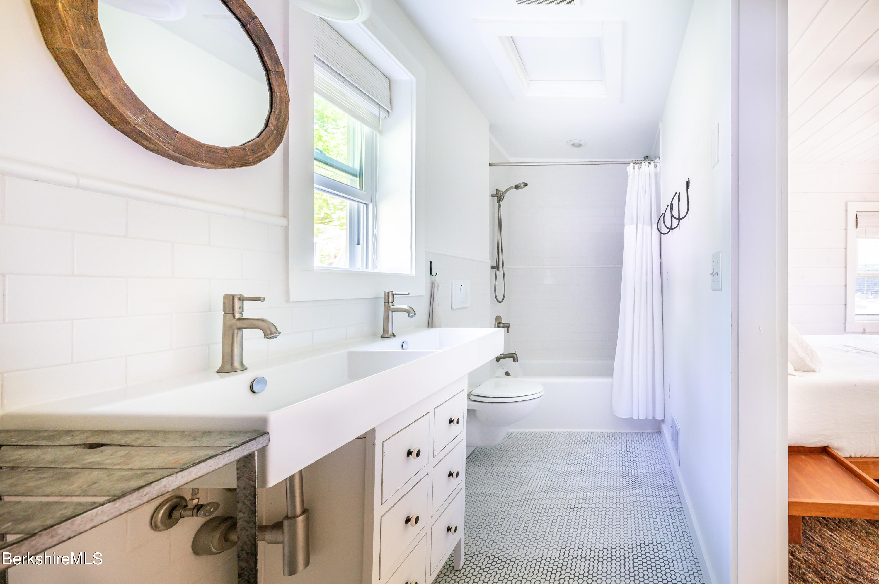 219 Shore Road Richmond, MA 01201 - Photo 13 of 28 a bathroom with a sink a toilet a mirror and shower