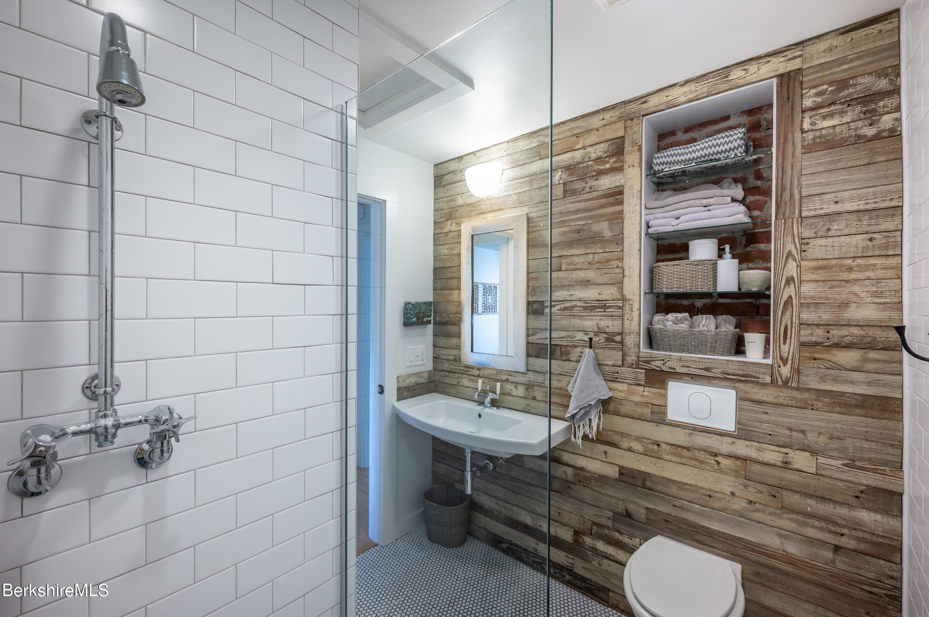 219 Shore Road Richmond, MA 01201 - Photo 15 of 28 a bathroom with a toilet a sink and mirror